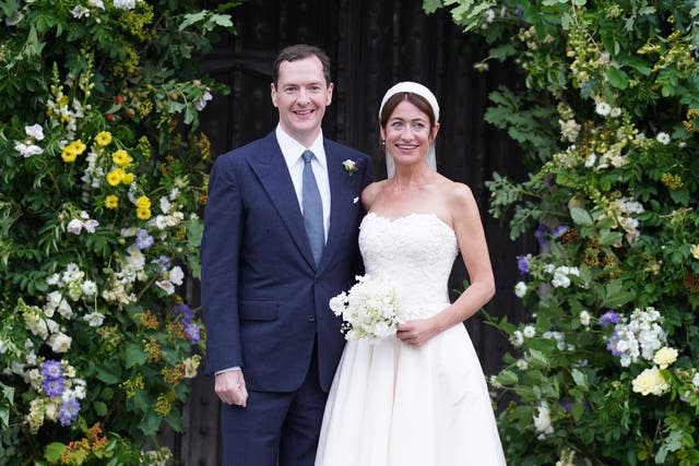 Mr and Mrs Osborne pose for pictures outside the pictures after getting married (Stefan Rousseau/PA)