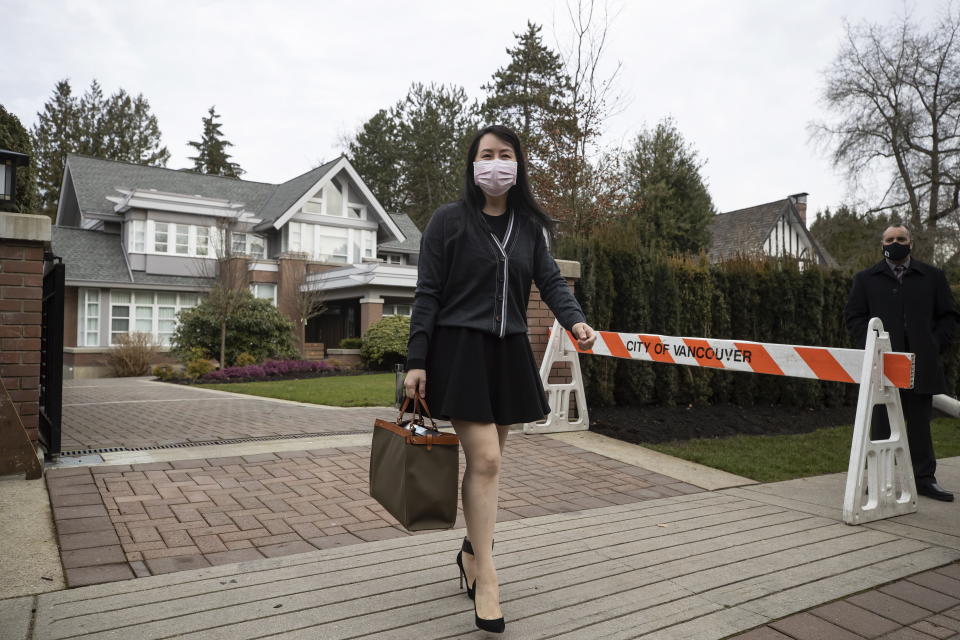 Meng Wanzhou, chief financial officer of Huawei, leaves her home to attend B.C. Supreme Court, in Vancouver, on Thursday, March 4, 2021. (Darryl Dyck/The Canadian Press via AP)