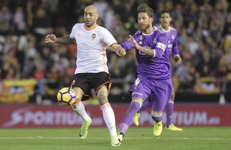 Football Soccer - Valencia v Real Madrid - Spanish La Liga Santander - Mestalla stadium, Valencia, Spain, 22/02/17 Real Madrid's Sergio Ramos (R) and Valencia's Simone Zaza in action. REUTERS/Heino Kalis