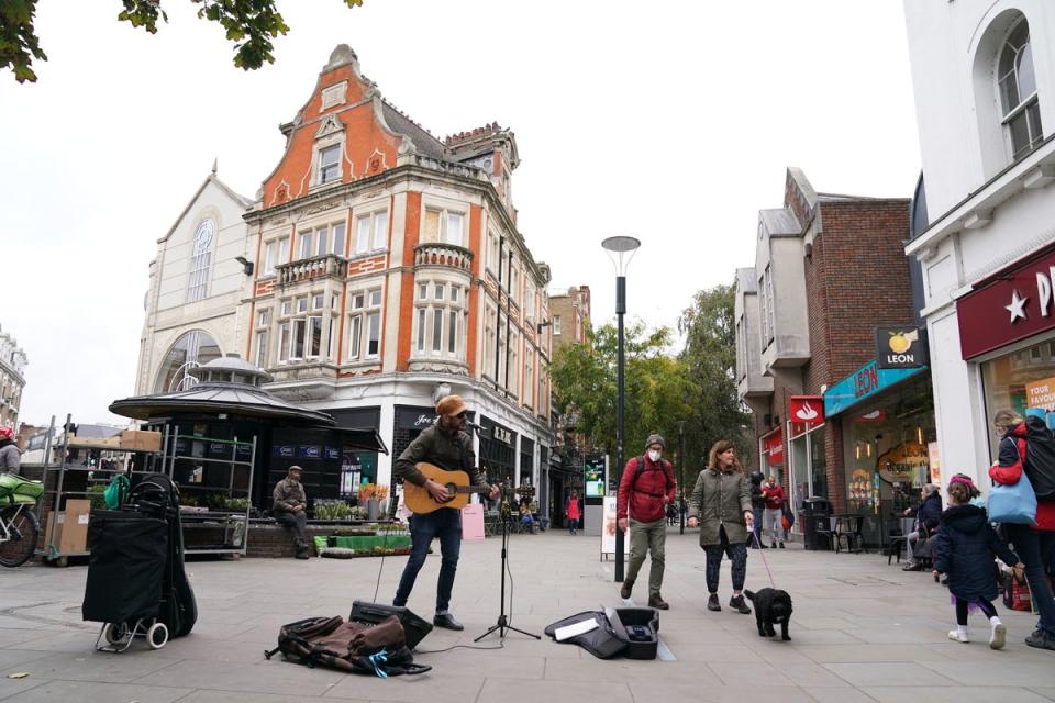 Shoppers in Richmond upon Thames, south west London (PA)