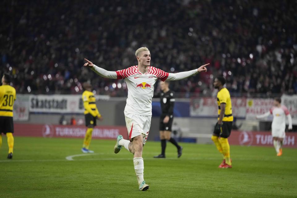Leipzig's Benjamin Sesko celebrates after scoring his side's first goal during the group G Champions League soccer match between RB Leipzig and Young Boys Bern at the Red Bull arena stadium in Leipzig, Germany, Wednesday, Dec. 13, 2023. (AP Photo/Matthias Schrader)