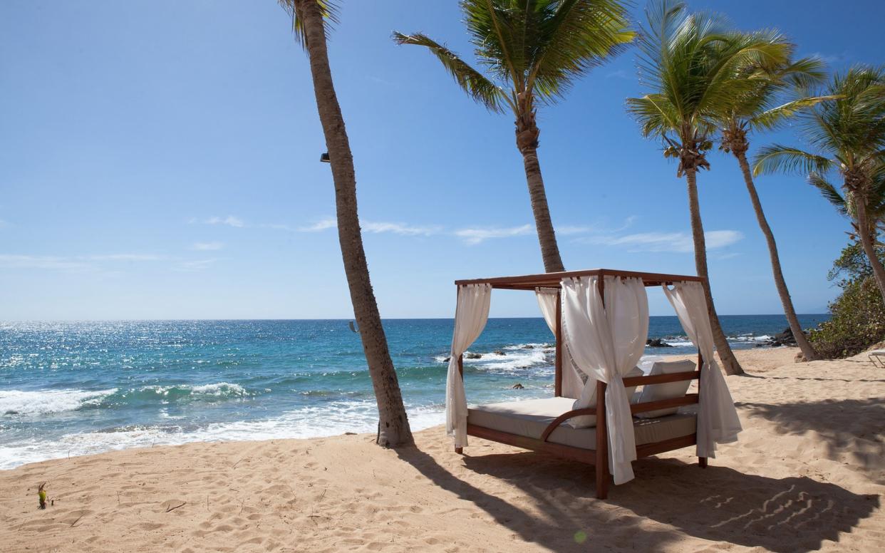 Overlooking a stretch of sandy beach replete with hammocks and a soundtrack of gentle surf, Curtain Bluff in Antigua is the perfect place to unwind