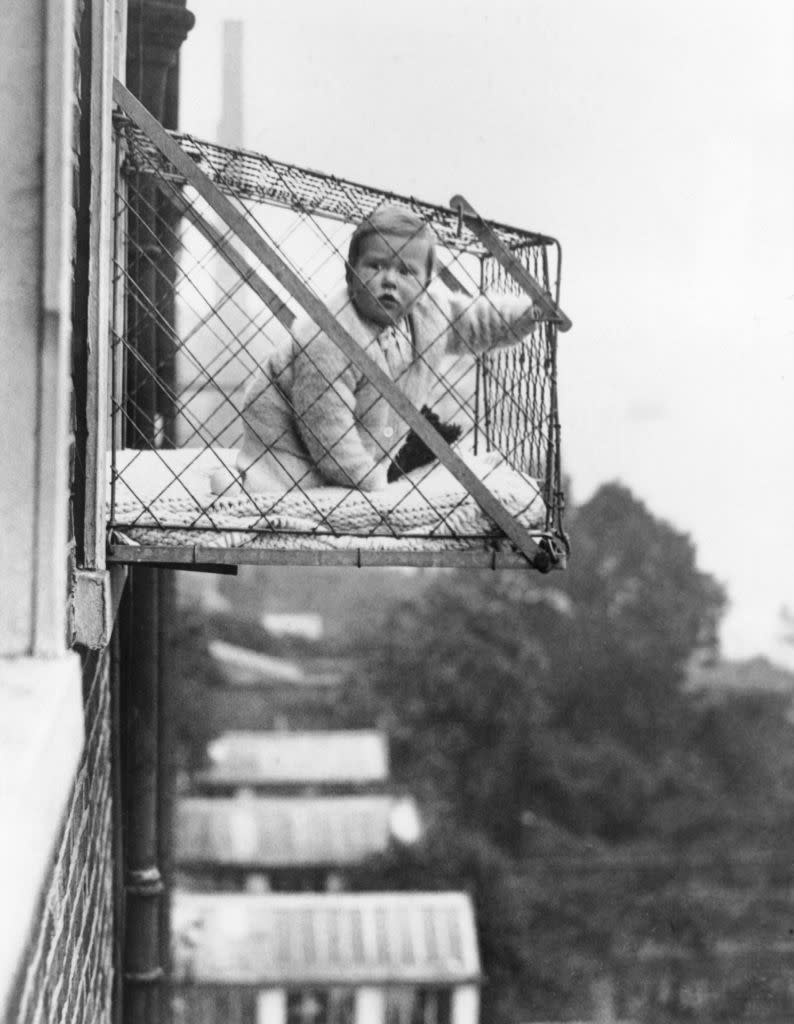 a baby in a cage