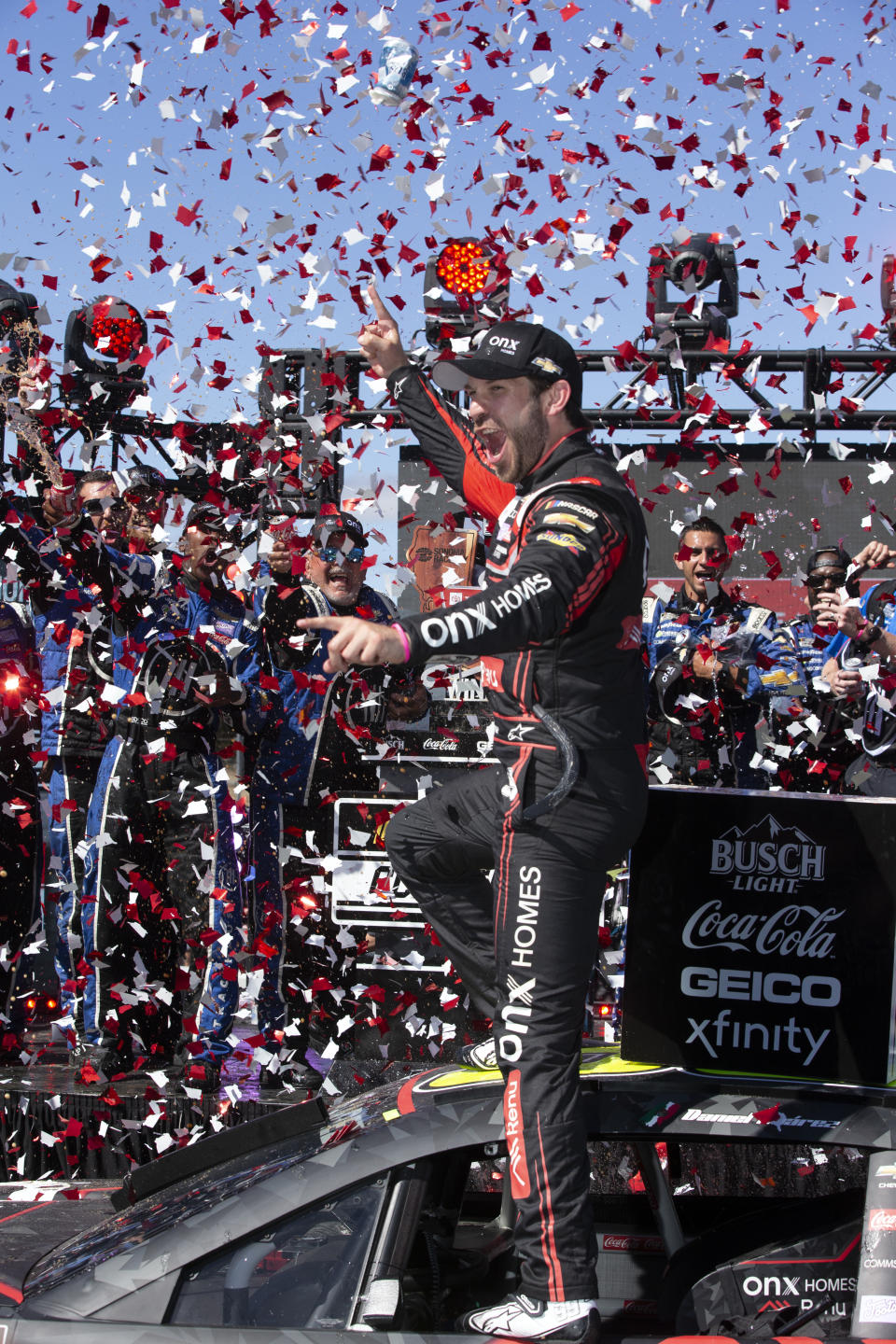 Daniel Suarez celebrates his victory in a NASCAR Cup Series auto race, Sunday, June 12, 2022, at Sonoma Raceway in Sonoma, Calif. (AP Photo/D. Ross Cameron)