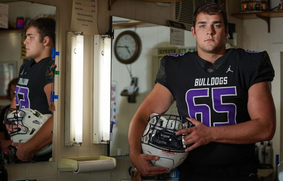 Brownsburg senior offensive lineman Leighton Jones (65) photographed on Tuesday, July 5, 2022, at Mizell's Barber Shop in Brownsburg. 