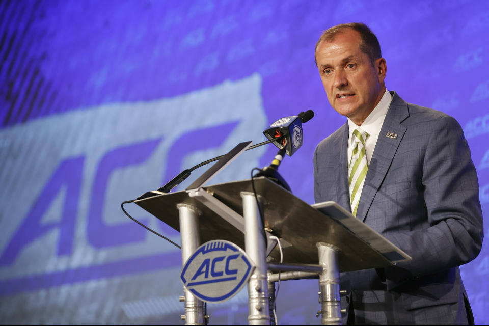 FILE - Atlantic Coast Conference commissioner Jim Phillips speaks during an NCAA college football news conference at the ACC media days in Charlotte, N.C., Wednesday, July 20, 2022. The Atlantic Coast Conference will hold five straight men’s basketball tournaments in North Carolina starting in 2025. The women’s basketball tournament that has had a longtime home in Greensboro as the city of the league’s founding will split time between there and Charlotte. The ACC announced future sites for championships in 14 sports Thursday, Feb. 8, 2024. (AP Photo/Nell Redmond, File)