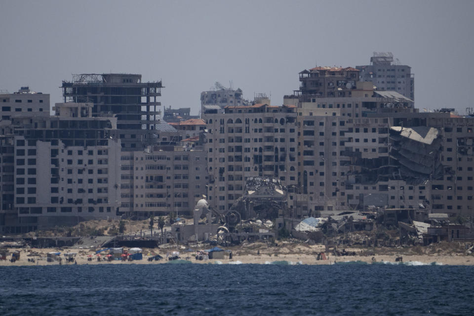 Destroyed buildings stand in the coast of the Gaza Strip as seen from the Mediterranean Sea, Tuesday, June 25, 2024. (AP Photo/Leo Correa)