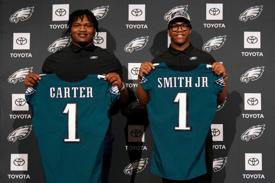 Jalen Carter, left, and Nolan Smith pose for a photo after a news conference at the newly renamed Philadelphia Eagles' NFL football team's training facility on Friday, April 28, 2023, in Philadelphia.