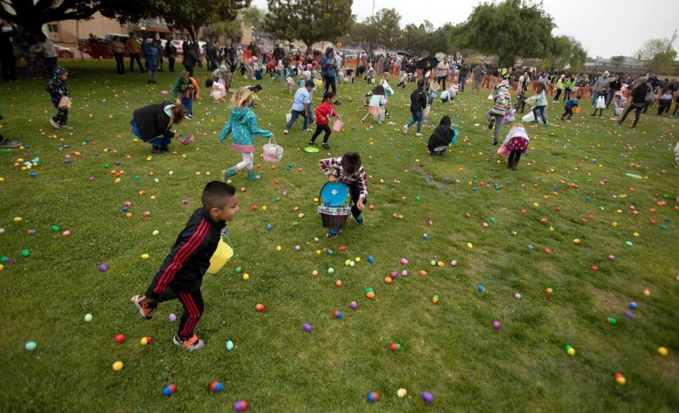 Hundreds of kids and parents braved a little rain to attend Arroyo Grande’s 33rd annual Easter Egg Hunt and Festival at Elm Street Park on Saturday, April 16, 2022. The free, time-staggered egg searches were held for ages 2 to adult. The kids could play in bounce houses, compete in a bunny hop and egg toss and snack on free hot dogs. Laura Dickinson/ldickinson@thetribunenews.com