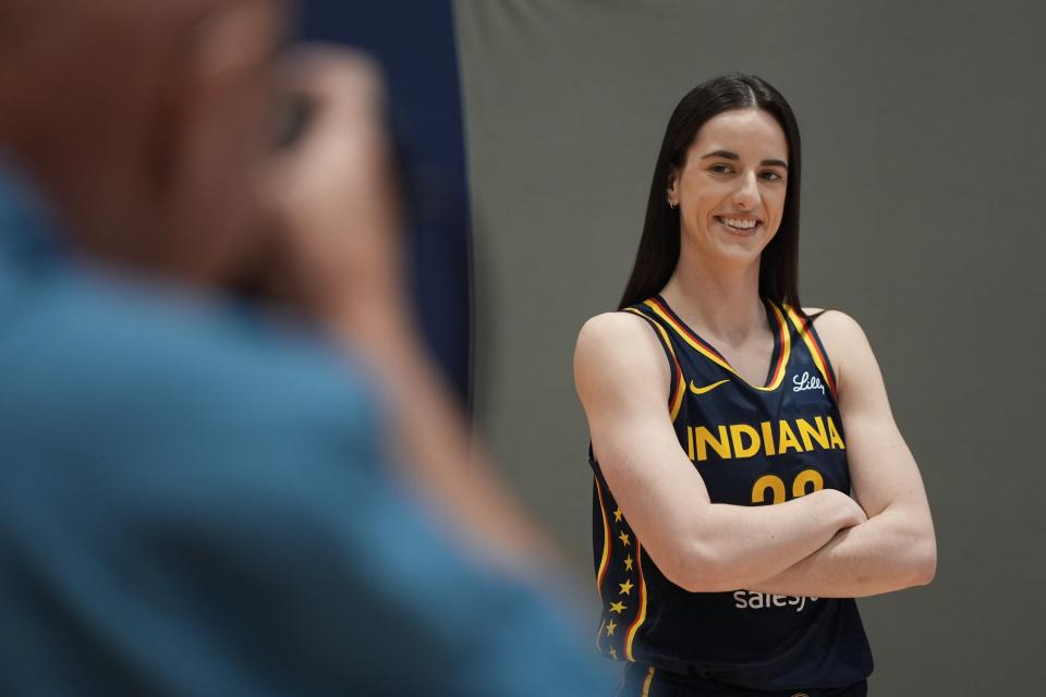 Indiana Fever's Caitlin Clark poses for a photo during the Indiana Fever's WNBA Basketball Media Day on Wednesday, May 1, 2024 in Indianapolis.  (AP Photo/Daron Cummings)