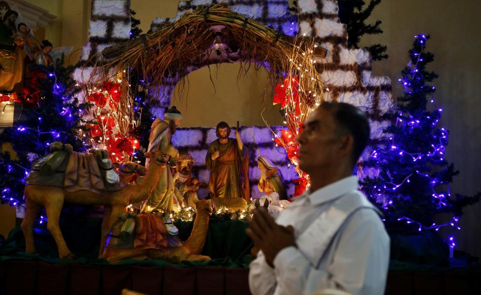 A Christmas manger is on display inside a church during the 4th day of Christmas vigil mass, known locally as "Misa de Gallo" in Tacloban city in central Philippines December 19, 2013. Super typhoon Haiyan reduced almost everything in its path to rubble when it swept ashore in the central Philippines on November 8, killing at least 6,069 people, leaving 1,779 missing and 4 million either homeless or with damaged homes. REUTERS/Erik De Castro (PHILIPPINES - Tags: DISASTER SOCIETY RELIGION)