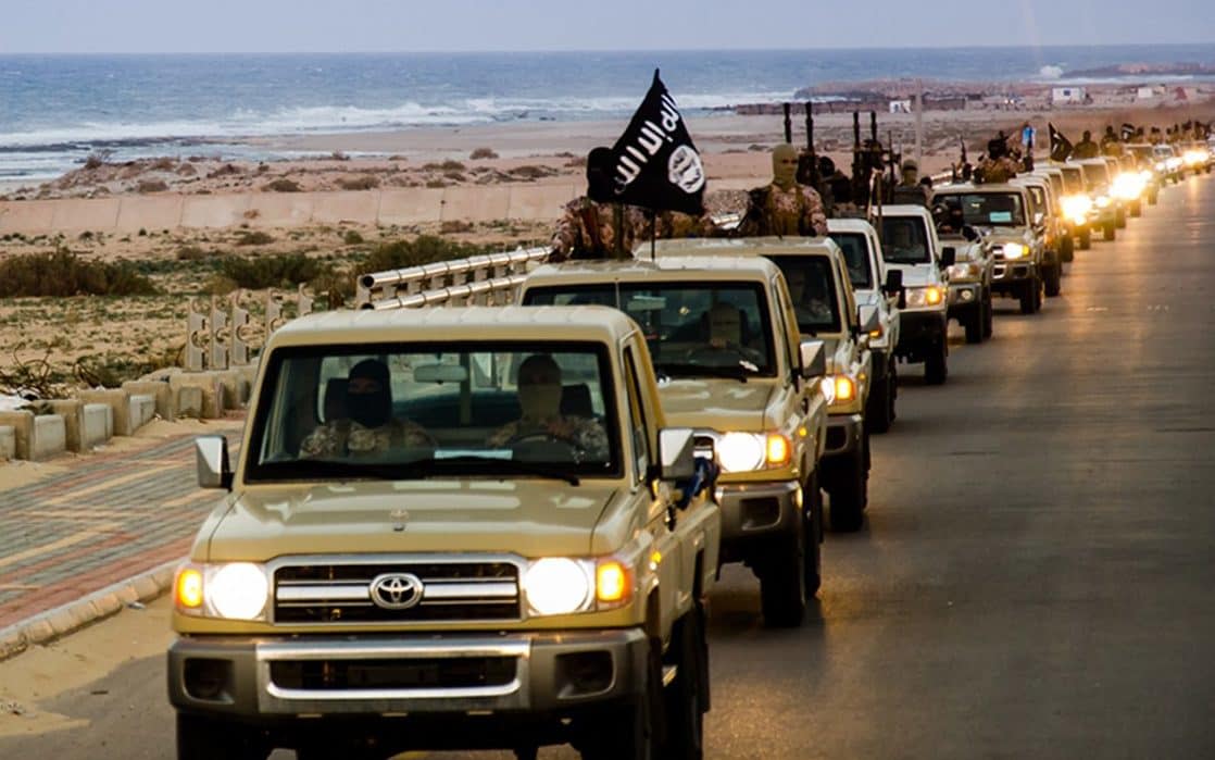 Islamic State (ISIL) militant group parading in a street in Libya's coastal city of Sirte - AFP