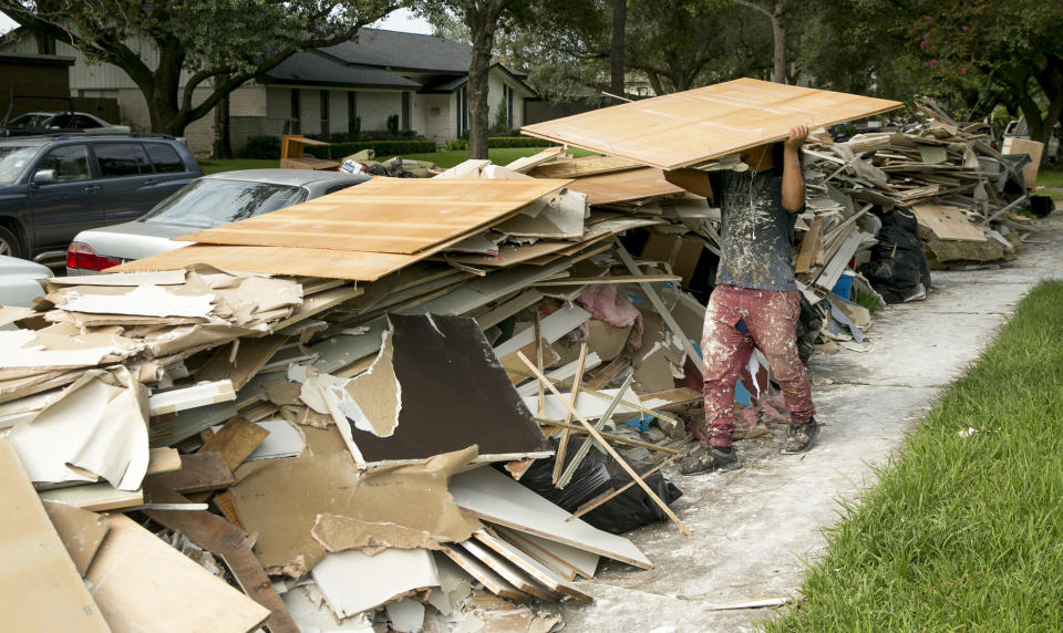 <p>Miguel Moncado, of Oxford Contractors, guts a flood-damaged home in the Meyerland neighborhood in Houston after Hurricane Harvey on Friday Sept, 1, 2017. (Photo: Jay Janner/Austin American-Statesman via AP) </p>