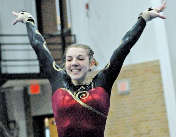 Milbank’s Courtney Trapp, left, won three individual events and the all-around title in the 2012 Vermillion Winter Wonderland Invitational gymnastics meet.