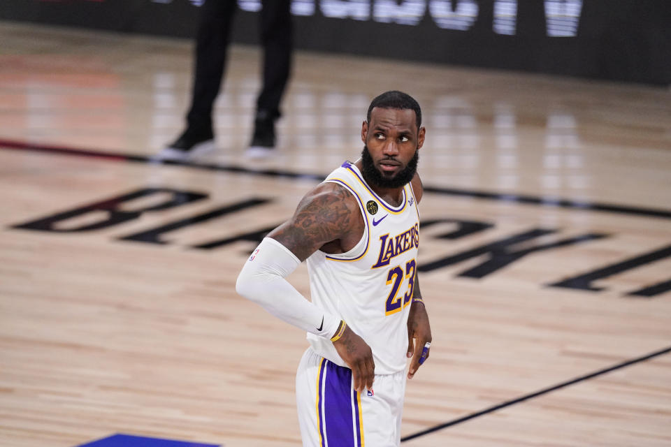 Los Angeles Lakers' LeBron James (23) looks on after scoring and being fouled during the first half in Game 3 of basketball's NBA Finals against Miami Heat, Sunday, Oct. 4, 2020, in Lake Buena Vista, Fla. (AP Photo/Mark J. Terrill)