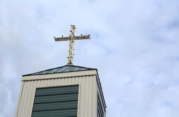 A petition demanding that Canada's Catholic churches disclose all documents related to residential schools and unmarked graves has garnered more than 6,000 signatures. It also calls on the Church to pay the full, promised compensation to residential school survivors. (John Last/CBC - image credit)