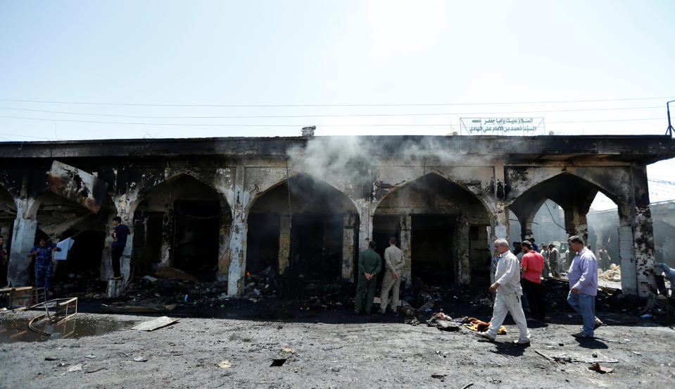 People gather at site of a suicide attack