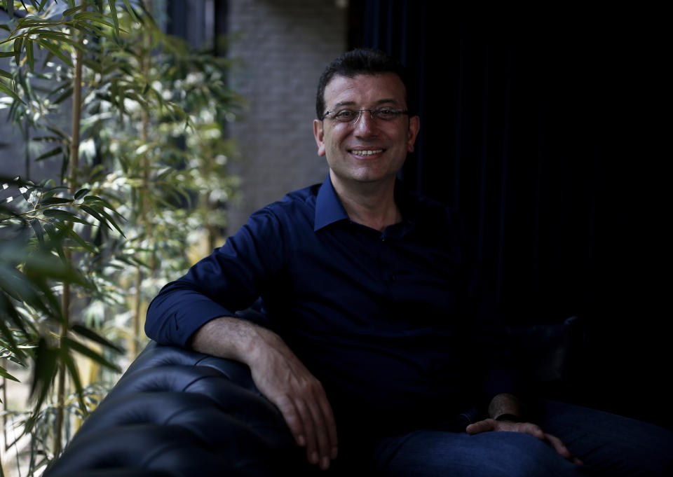 In this Monday, June 17, 2019 photo, Ekrem Imamoglu, candidate of the secular opposition Republican People's Party, or CHP, ahead of June 23 re-run of Istanbul elections, poses for photographs following an interview with The Associated Press, ahead of the June 23 re-run of Istanbul elections, in Istanbul. Millions of voters in Istanbul go back to the polls for a controversial mayoral election re-run Sunday, as President Recep Tayyip Erdogan's party tries to wrest back control of Turkey's largest city. (AP Photo/Emrah Gurel)