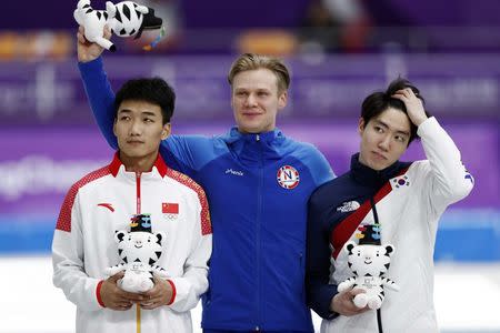 Speed Skating - Pyeongchang 2018 Winter Olympics - Men's 500m competition finals - Gangneung Oval - Gangneung, South Korea - February 19, 2018 - Havard Lorentzen of Norway, Cha Min Kyu of South Korea and Tingyu Gal of China celebrate a on the podium. REUTERS/Damir Sagolj