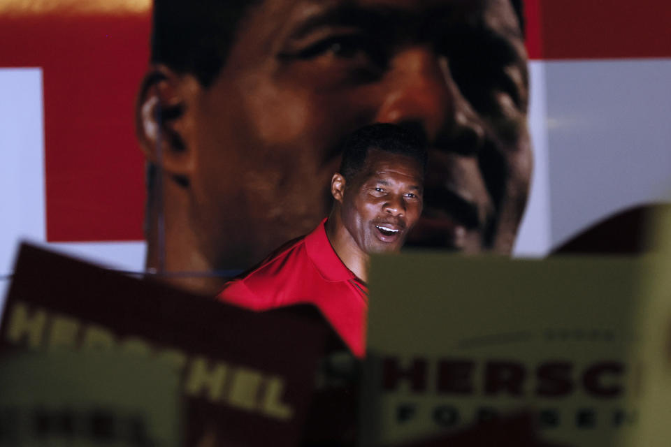 Herschel Walker, Republican candidate for U.S. Senate in Georgia, addresses supporters during a rally on the eve of midterm elections at Governors Gun Club in Kennesaw, Ga., on Monday, Nov. 7, 2022. (Miguel Martinez/Atlanta Journal-Constitution via AP)