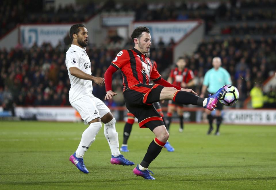 <p>AFC Bournemouth’s Adam Smith controls the ball </p>