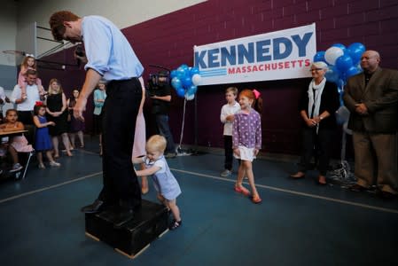 U.S. Rep. Kennedy III is interrupted by his son James while announcing his candidacy for the U.S. Senate in Boston