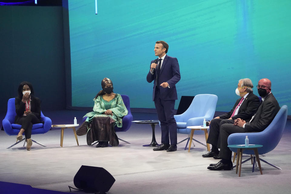 French President Emmanuel Macron, center delivers his speech with, from left to right, Shantel Marekera, founder of "Little Dreamers Foundation", UN Women's Executive Director Phumzile Mlambo-Ngcuka, United Nations Secretary General Antonio Guterres, and European Council President Charles Michel attend an international conference aims to fast-track the road to gender equality and mobilize millions of dollars to achieve the long-sought goal quickly, at the Louvre Carrousel in Paris, France, Wednesday, June 30, 2021. UN Women's Executive Director Phumzile Mlambo-Ngcuka said in an interview with The Associated Press that the underfunding of women's programs and the slow implementation of a 150-platform to achieve gender equality adopted by the world's nations in Beijing in 1995 "leaves a lot of women in a situation where they will never really realize their true and full potential." (AP Photo/Michel Euler)