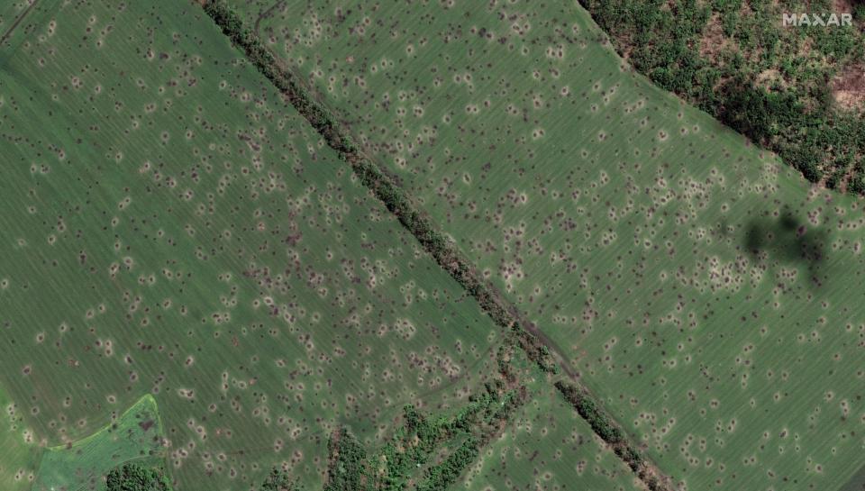 Fields peppered with hundreds of artillery craters (Satellite image ©2022 Maxar Technologies.)