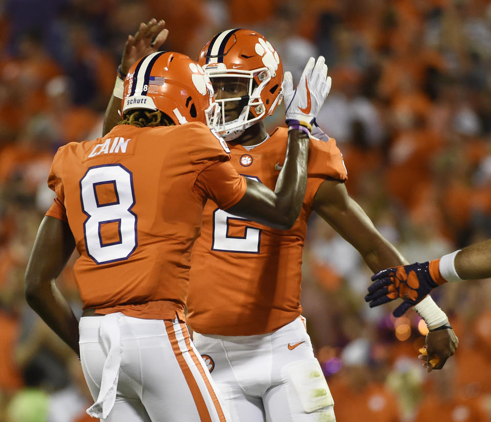 Clemson quarterback Kelly Bryant (2) celebrates with Deon Cain (8) after scoring a touchdown against Auburn during the first half of an NCAA college football game, Saturday, Sept. 9, 2017, in Clemson, S.C. (AP Photo/Rainier Ehrhardt)