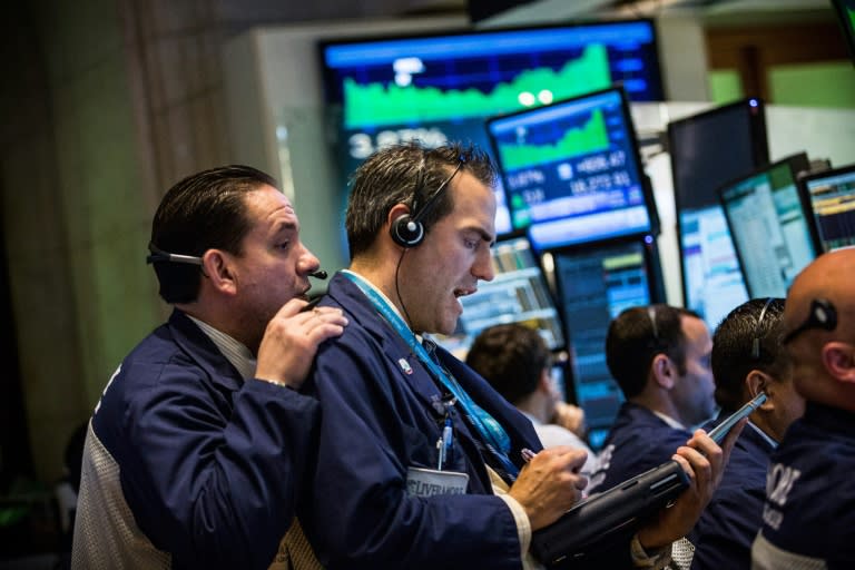 Traders work on the floor of the New York Stock Exchange during the afternoon of August 26, 2015 in New York