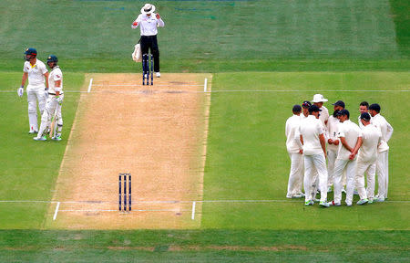 Cricket - Ashes test match - Australia v England - Adelaide Oval, Adelaide, Australia, December 3, 2017. England's James Anderson reacts with team mates as Australia's Tim Paine and Shaun Marsh appeal an umpire's LBW decision during the second day of the second Ashes cricket test match. REUTERS/David Gray