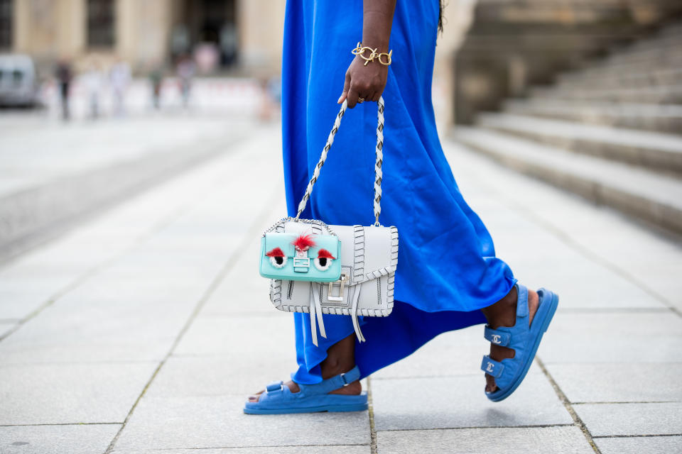 BERLIN, GERMANY - MAY 30: Lois Opoku is seen wearing blue dress Tibi, Chanel sandals, Fendi mini bag and Proenza Schouler bag on May 30, 2020 in Berlin, Germany. (Photo by Christian Vierig/Getty Images)