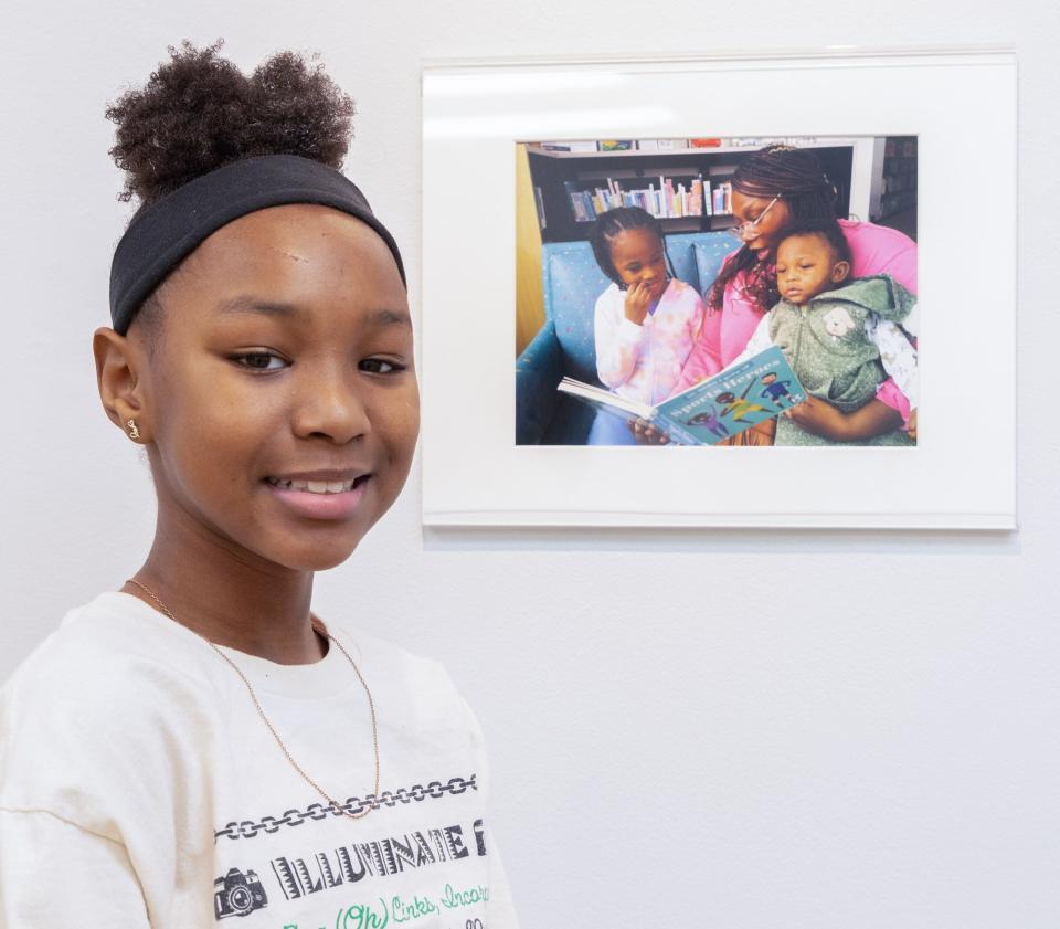 Saeedah Haines placed third in the Overall Best Photograph category for “Story Time." The photo is part of an exhibit during Black History Month and through March 17 at the Massillon Museum.