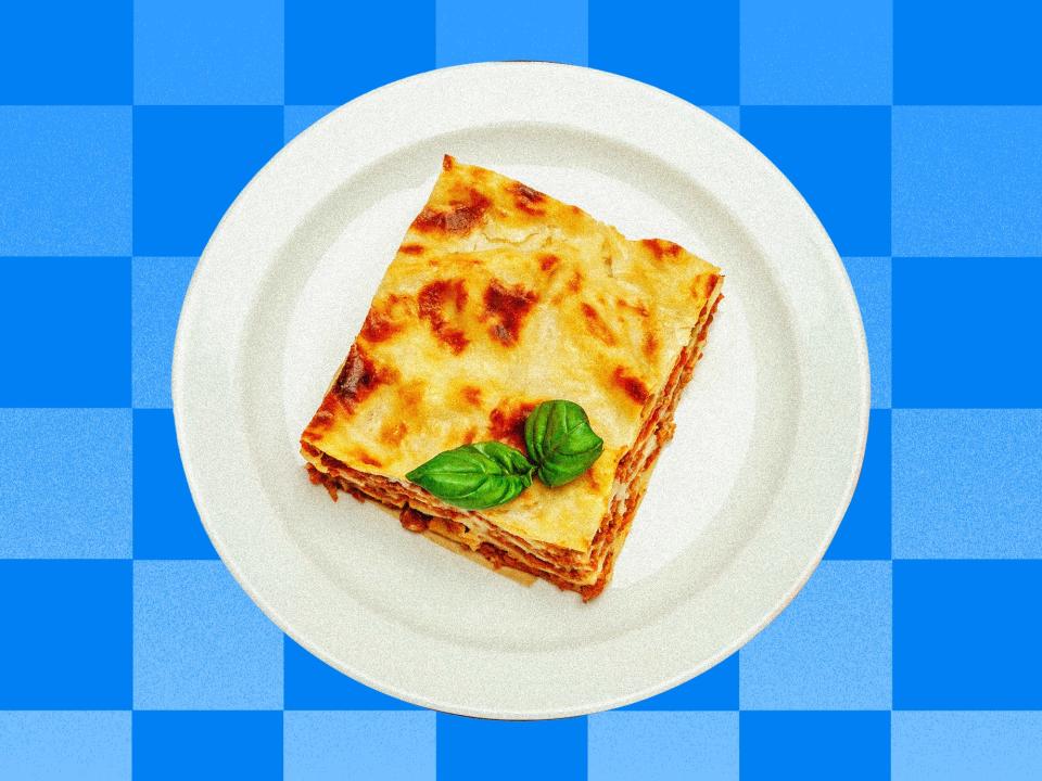 Left over Lasagna in front of a blue checkered background