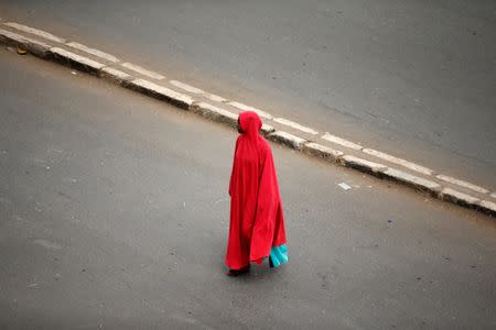 A woman walks outside the walled city of Harar, Ethiopia, February 25, 2017. REUTERS/Tiksa Negeri