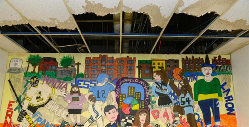 A mural in Greater Johnstown School District’s former middle school facility that was closed in 2017 when deteriorating conditions were deemed unsafe for students. The ceiling was damaged by leaky pipes. (The Public Interest Law Center)