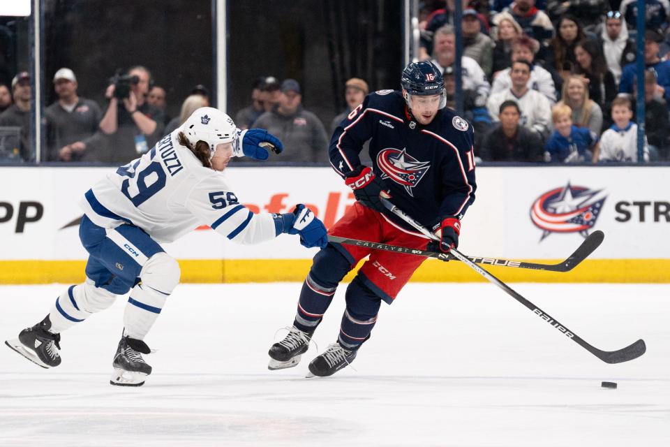 Dec 29, 2023; Columbus, Ohio, USA;
Columbus Blue Jackets center Brendan Gaunce (16) makes his way down the rink against Toronto Maple Leafs left wing Tyler Bertuzzi (59) during the third period of their game on Friday, Dec. 29, 2023 at Nationwide Arena.