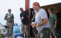 <p>Chaplain Ed Bowman leads members of self-described patriot groups and militias in a religious service during III% United Patriots’ Field Training Exercise outside Fountain, Colo., July 29, 2017. (Photo: Jim Urquhart/Reuters) </p>