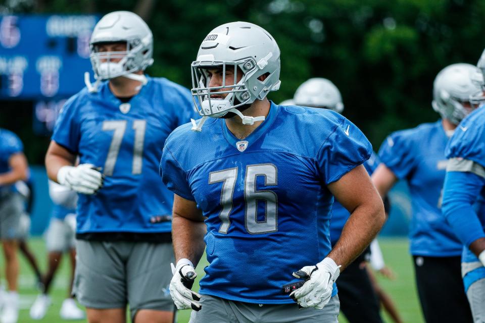 Lions offensive lineman Zein Obeid warms up during minicamp in Allen Park on Wednesday, June 8, 2022.