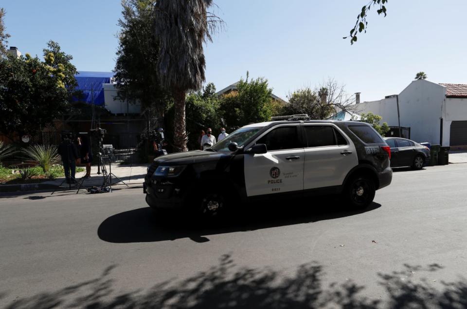 <div class="inline-image__caption"><p>A police car drives past the site of Lady Gaga’s dognapping in Los Angeles.</p></div> <div class="inline-image__credit">Mario Anzuoni/Reuters</div>