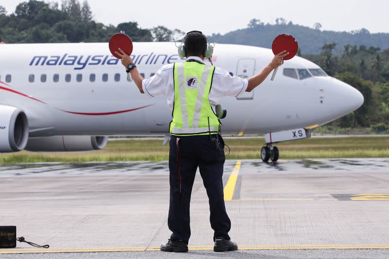 A Malaysia Airlines plane carrying the first batch of tourists arrives at the airport as Langkawi reopens to domestic tourists, amid the coronavirus disease (COVID-19) pandemic, in Malaysia