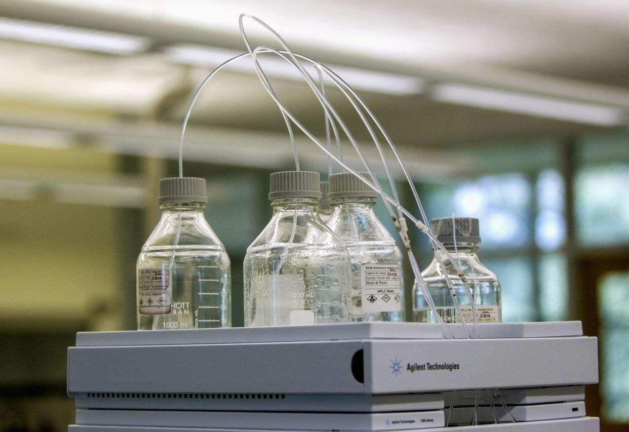 In this June 18, 2018 photo, equipment used to test for perfluoroalkyl and polyfluoroalkyl substances, known collectively as PFAS, in drinking water is seen at Trident Laboratories in Holland, Mich. 