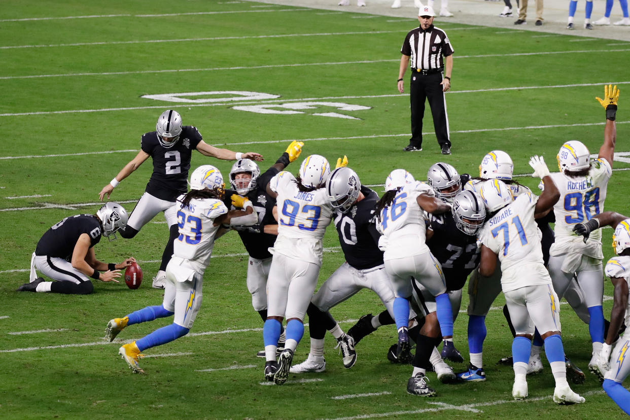 LAS VEGAS, NEVADA - DECEMBER 17: Kicker Daniel Carlson #2 of the Las Vegas Raiders attempts a field goal against the Los Angeles Chargers during the NFL game at Allegiant Stadium on December 17, 2020 in Las Vegas, Nevada. The Chargers defeated the Raiders in overtime 30-27. (Photo by Christian Petersen/Getty Images)