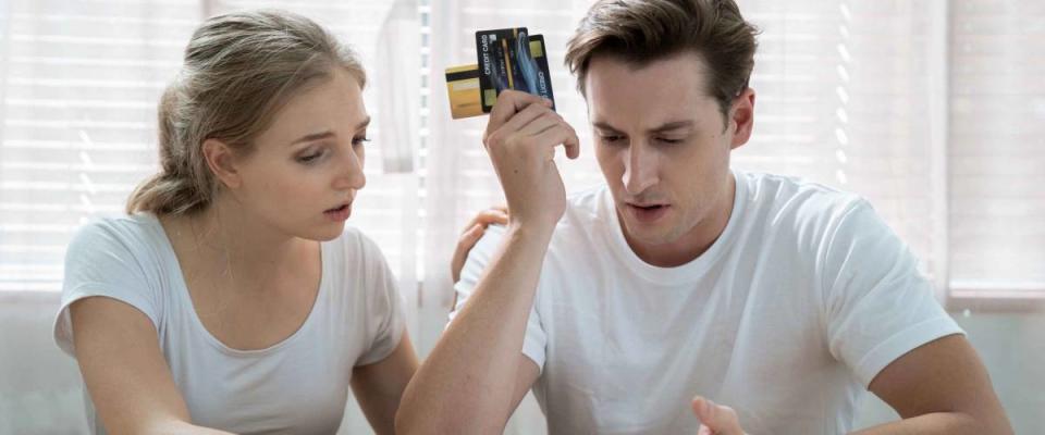 Stressed Caucasian couple, They are trying to get money to pay off their credit card debt, Financial problems from the coronavirus or covid-19 outbreak.