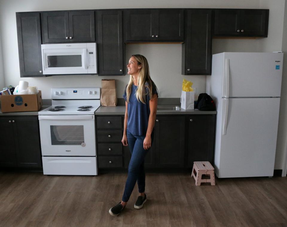 Chelsea Chase, the first resident to move into the Portsmouth Housing Authority's new Ruth Lewin Griffin Place, is seen in her apartment Thursday, June 2, 2022.