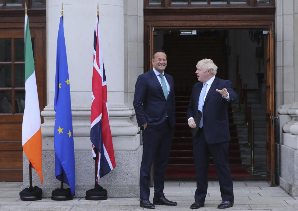 Britain's Prime Minister Boris Johnson, right, is welcomed by Ireland's Prime Minister Leo Varadkar at Government Buildings in Dublin, Monday Sept. 9, 2019. Boris Johnson is to meet with Leo Varadkar in search of a compromise on the simmering Brexit crisis. (Niall Carson/PA via AP)