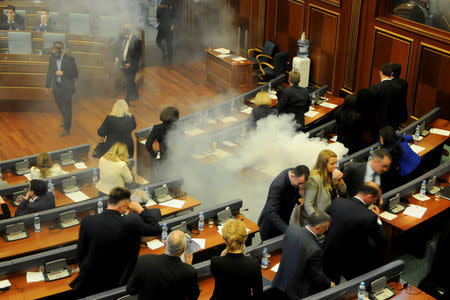Kosovo opposition politicians release tear gas in parliament to obstruct a session in Pristina, Kosovo March 21, 2018. REUTERS/Laura Hasani