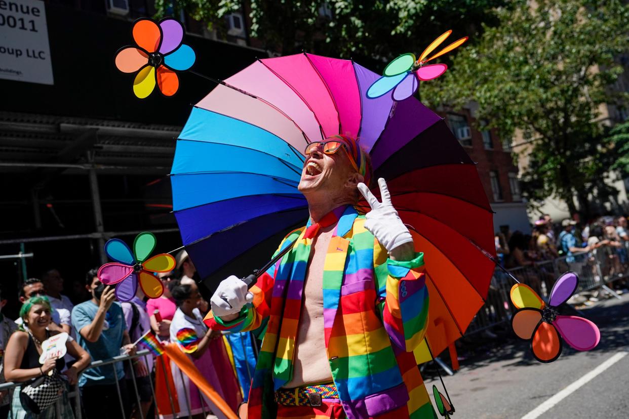 A reveler marches down Fifth Avenue during the annual NYC Pride March, Sunday, June 26, 2022, in New York. 