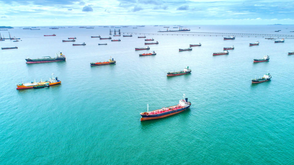 Several oil tankers at a port.