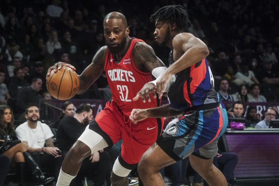 Houston Rockets' Jeff Green, left, drives around Brooklyn Nets' Cam Thomas during the first half of an NBA basketball game Saturday, Jan. 27, 2024, in New York. (AP Photo/Bebeto Matthews)
